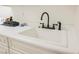 Clean laundry room sink featuring a stylish faucet and neutral countertop at 2050 W Warm Springs Rd # 4322, Henderson, NV 89014