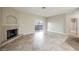 Open living room featuring fireplace, sliding glass door, and tile flooring at 2050 W Warm Springs Rd # 4322, Henderson, NV 89014