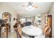 View of living room showing the kitchen and dining areas, tile flooring, and ceiling fan at 2050 W Warm Springs Rd # 4322, Henderson, NV 89014