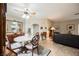 Open-concept living and dining area featuring tile floors, a fireplace, and natural light at 2050 W Warm Springs Rd # 4322, Henderson, NV 89014