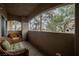 Comfortable outdoor patio with wicker furniture and a view of trees and landscaping at 2050 W Warm Springs Rd # 4322, Henderson, NV 89014