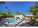 Beautiful pool area surrounded by palm trees and a unique bridge feature for a resort-like living experience at 2050 W Warm Springs Rd # 4322, Henderson, NV 89014