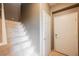 Interior view of a staircase with tan walls and white tile steps at 2050 W Warm Springs Rd # 4322, Henderson, NV 89014