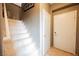 Entry stairway with white tiling leading to a multi-panel door and garage entrance at 2050 W Warm Springs Rd # 4322, Henderson, NV 89014