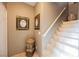 A stairway entrance decorated with paintings and an decorative urn at 2050 W Warm Springs Rd # 4322, Henderson, NV 89014
