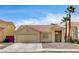 Charming single-story home with desert landscaping, tile roof, and attached two car garage at 2471 Grand Basin Dr, Las Vegas, NV 89156