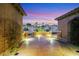 A covered patio has desert landscaping and a view of neighboring houses at 2491 Hardin Ridge Dr, Henderson, NV 89052