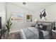 Cozy bedroom with plush bedding, modern decor, and ample natural light from the window at 2648 E Sparrow Way, Pahrump, NV 89048