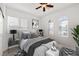 A primary bedroom filled with natural light from windows and arched transom windows at 2648 E Sparrow Way, Pahrump, NV 89048