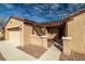 Front entrance with a pergola, desert landscaping, and a covered walkway leading to the front door at 2648 E Sparrow Way, Pahrump, NV 89048