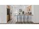 Well-lit kitchen featuring stainless steel appliances, breakfast bar seating, and ample cabinet space at 2648 E Sparrow Way, Pahrump, NV 89048