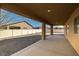 Large, covered patio that offers great outdoor living with a view of the backyard and neighborhood at 2648 E Sparrow Way, Pahrump, NV 89048
