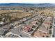 An aerial street view shows a desert neighborhood with a street winding through, on a sunny day with mountains in the background at 2648 E Sparrow Way, Pahrump, NV 89048