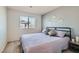 Comfortable bedroom featuring carpet, a full bed, and a soothing, painted accent wall at 2773 Frosted Teal Ave, North Las Vegas, NV 89086