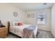 Cozy bedroom features carpet, a double bed, light-colored walls, and a window at 2773 Frosted Teal Ave, North Las Vegas, NV 89086
