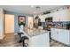 Modern kitchen with granite countertops, stainless steel appliances, and center island with bar seating at 2773 Frosted Teal Ave, North Las Vegas, NV 89086