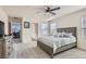 Spacious main bedroom with a king bed, ceiling fan, and views to an office space at 2773 Frosted Teal Ave, North Las Vegas, NV 89086