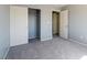 Bedroom features closet with sliding doors and neutral carpet at 304 Iron Summit Ave, North Las Vegas, NV 89031