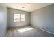 Bedroom features neutral carpet, and a window that brings in lots of natural light at 304 Iron Summit Ave, North Las Vegas, NV 89031