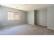 Neutral bedroom with a large window providing natural light at 304 Iron Summit Ave, North Las Vegas, NV 89031