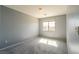 Neutral bedroom featuring a window for natural light at 304 Iron Summit Ave, North Las Vegas, NV 89031
