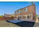 Rear elevation of home with backyard and block pavers at 304 Iron Summit Ave, North Las Vegas, NV 89031