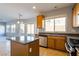 Kitchen featuring a center island, stainless steel appliances, and granite countertops at 304 Iron Summit Ave, North Las Vegas, NV 89031