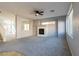 Comfortable living room showcases a fireplace, neutral carpet, and an open layout for seamless entertaining at 304 Iron Summit Ave, North Las Vegas, NV 89031