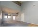 Open-concept living room with high ceilings, plush carpet, and views of the upper level at 304 Iron Summit Ave, North Las Vegas, NV 89031