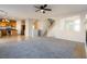 Spacious living room featuring a fireplace and staircase leading to the upper level at 304 Iron Summit Ave, North Las Vegas, NV 89031