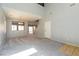 Spacious living room boasts plush carpet, high ceilings, and a staircase leading to the upper level at 304 Iron Summit Ave, North Las Vegas, NV 89031