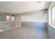 Bright and airy loft area with carpet and a view from the window at 304 Iron Summit Ave, North Las Vegas, NV 89031