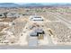 Expansive aerial view of desert home with large lot, pool, and outbuildings at 3050 Oakridge Ave, Pahrump, NV 89048