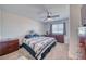 Comfortable bedroom featuring a ceiling fan, large window, and neutral decor at 3050 Oakridge Ave, Pahrump, NV 89048