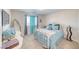 Cozy bedroom with natural light, decorated with light blue accents and comfortable furnishings at 3050 Oakridge Ave, Pahrump, NV 89048