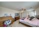 Spacious bedroom with a desk, tv, and comfortable furnishings at 3050 Oakridge Ave, Pahrump, NV 89048