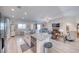 This open-concept kitchen features stainless steel appliances, a large granite island, and a full view of the living area at 3050 Oakridge Ave, Pahrump, NV 89048