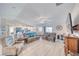 Spacious living room featuring luxury flooring, a ceiling fan, and natural light at 3050 Oakridge Ave, Pahrump, NV 89048