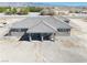 This beautiful home features a covered patio and low maintenance desert landscaping at 3050 Oakridge Ave, Pahrump, NV 89048