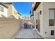 Private backyard with a grill, air conditioning unit, and a brick wall at 3354 Via Strada St, Henderson, NV 89044