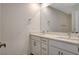 Bathroom featuring a double sink vanity with a large mirror and modern faucets at 3354 Via Strada St, Henderson, NV 89044