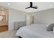 Bright bedroom features a modern ceiling fan and dresser, with access to an ensuite bathroom at 3354 Via Strada St, Henderson, NV 89044
