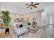 Open-concept living room with white walls and a gray sofa on a patterned rug at 3354 Via Strada St, Henderson, NV 89044
