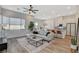 Inviting living room with a neutral color palette, stylish sectional sofa, and modern decor at 3354 Via Strada St, Henderson, NV 89044