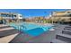 Community swimming pool with ample seating and lounge chairs for residents' enjoyment at 3354 Via Strada St, Henderson, NV 89044