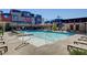 Community pool offers residents a recreational space with seating, lounge chairs, and shade at 3354 Via Strada St, Henderson, NV 89044