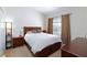 Clean bedroom featuring a comfortable queen-size bed with side tables and soft natural light from the window at 3660 Renovah St # 201, Las Vegas, NV 89129