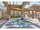 Community hot tub with lounge chairs and desert landscaping, ideal for relaxation at 3660 Renovah St # 201, Las Vegas, NV 89129