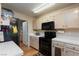 Efficient kitchen space with white countertops and modern appliances at 3660 Renovah St # 201, Las Vegas, NV 89129
