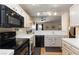 Functional kitchen with white cabinets and essential appliances at 3660 Renovah St # 201, Las Vegas, NV 89129